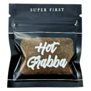 Hot Grabba cannabis product packaging featuring a brown herbal blend in a clear bag labeled "Hot Grabba" and "Super First."
